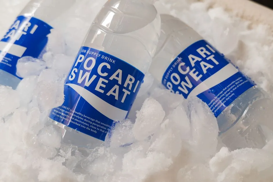 Chilled Pocari Sweat bottles resting in ice, showcasing hydration and refreshment.